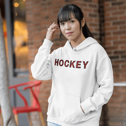 Introducing the Canada Hockey Hoodie, featuring "Hockey" in bold red and black Canadian plaid lettering—because nothing says “I’m Canadian” like plaid and hockey pride.